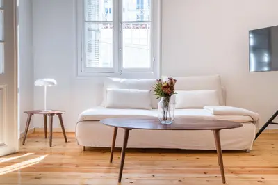 a living room with a couch and a table at Cream in Athens