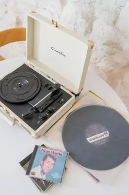 a record player and a cd in a box at Cream in Athens