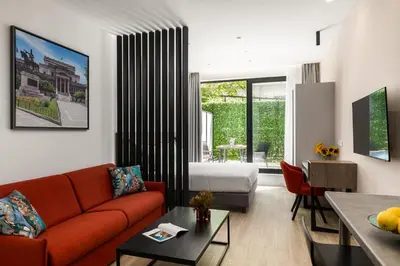 a living room with a couch and a bed at Hestia - Averof 7 in Athens