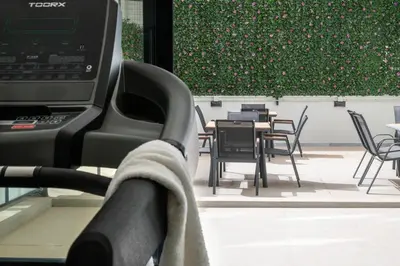a person is exercising on a treadmill in a restaurant at Hestia - Averof 7 in Athens