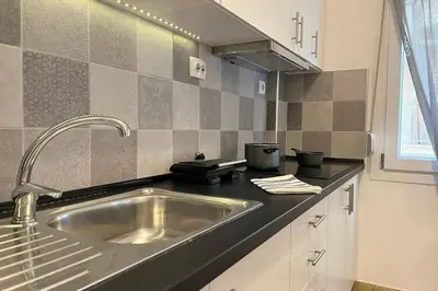 a kitchen with a stainless steel kitchen sink at Pame Rentals - Ideal For 4 in Pagrati in Athens