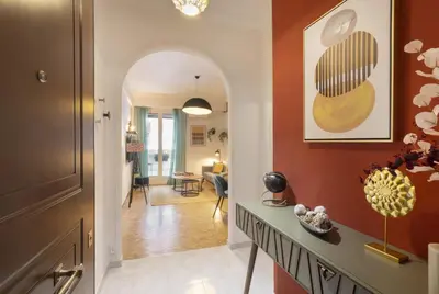 a hallway with an archway leading to a living room at Pausaniou8 in Athens