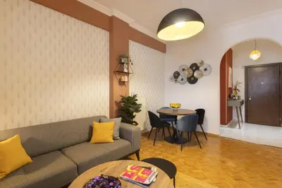 a living room with a couch and a table at Pausaniou8 in Athens