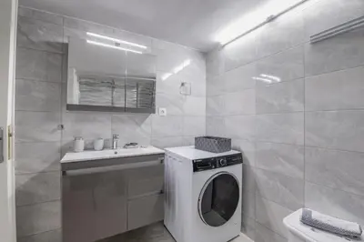 a bathroom with a washing machine and a sink at Marina Zeas Hidden Gem in Piraeus