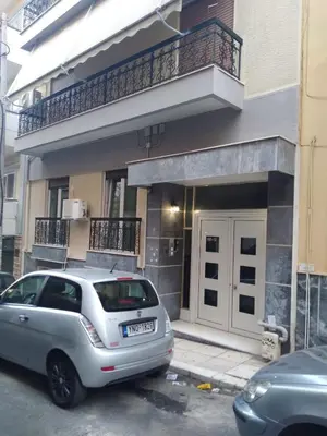 a silver car parked in front of a building at Marina Zeas Hidden Gem in Piraeus