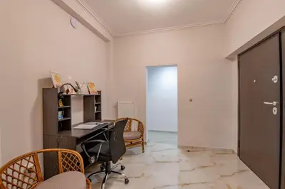 an office with a desk and chairs and a door at Marina Zeas Hidden Gem in Piraeus