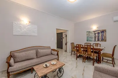 a living room with a couch and a table at Marina Zeas Hidden Gem in Piraeus