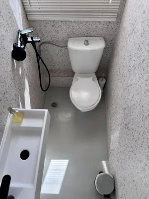 a small bathroom with a toilet and a sink at Athenian Sky in Athens