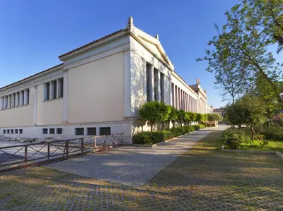 a large white building with a sidewalk in front of it at Comfortable apartment next to Museum and park in Athens