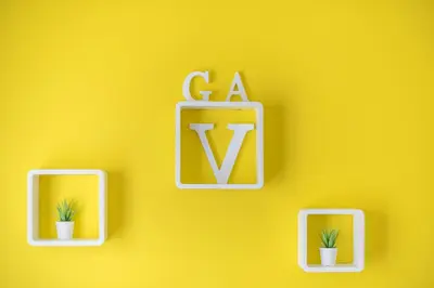 a yellow wall with a cà and two plants at Virona 2nd Floor Greece Apartments in Athens