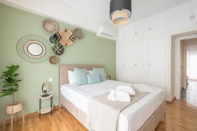 a bedroom with a large white bed in a room at The Luxury Suite by Cloudkeys in Athens