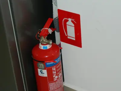 a red fire hydrant is next to a door at 'Η Ωραία των Αθηνών' A Lux & Cozy Apt in Athens in Athens