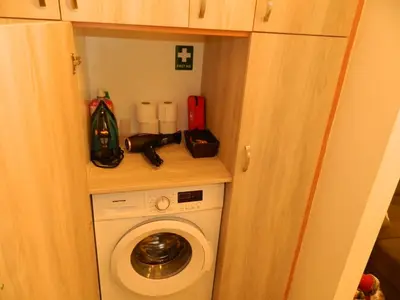 a small bathroom with a washing machine in a room at 'Η Ωραία των Αθηνών' A Lux & Cozy Apt in Athens in Athens