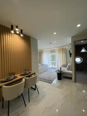 a living room with a table and chairs and a couch at URBAN SUITES ATHENS in Athens