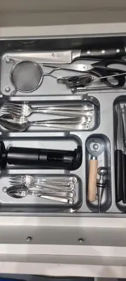 a drawer full of kitchen utensils and other kitchen items at The island studio in Piraeus