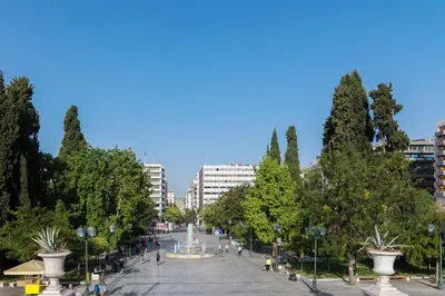 a street in a city with trees and buildings at Exclusive Studio in Athens A in Athens