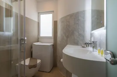 a bathroom with a sink and a toilet and a shower at Elegant Studio In Athens B in Athens