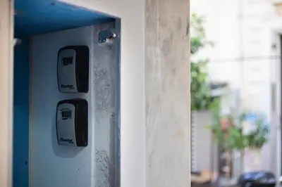 a close up of two electrical switches on a wall at Bright 2BDR Apartment Downtown Exarcheia! in Athens