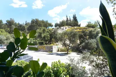a view of a parking lot with trees at Hill View Apartment near Acropolis in Athens