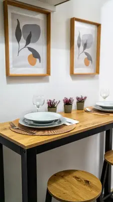 a table with plates and glasses on top of it at Lux Garden Apartment near Acropolis in the heart of Athens in Athens