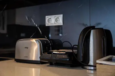 two toasters sitting on top of a counter at Attiki - Appartment in Athens