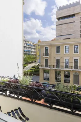 a balcony with a view of a building at Versi2- Stylish 1BR pays homage to timeless charm in Athens