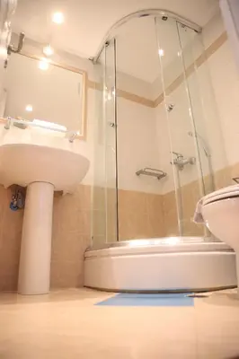 a bathroom with a shower and a sink and a tub at Sunset Sea Mini Studio Anavissos in Anavissos