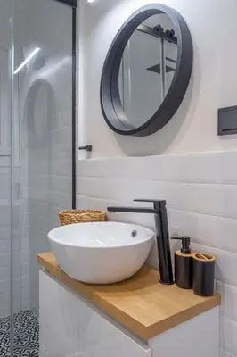 a bathroom with a white sink and a mirror at LIV - Modern Flat in Kolonaki in Athens