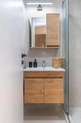 a bathroom with a sink and a mirror at LIV - Modern Flat in Kolonaki in Athens