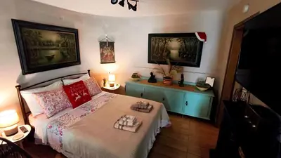 a bedroom with a bed with two trays on it at Zoe garden home in Spáta
