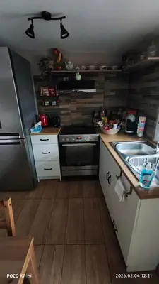 a small kitchen with a sink and a stove at Zoe garden home in Spáta