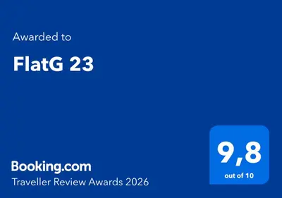 a screenshot of a cell phone with the text awarded to flg traveller review at FlatG 23 in Athens