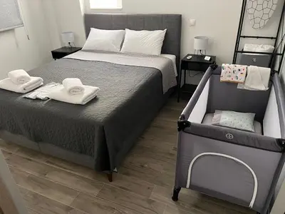 a bedroom with a bed with towels on it at FlatG 23 in Athens