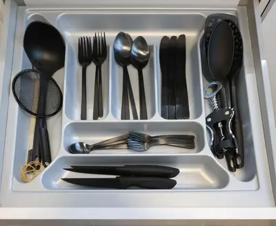 a white tray with utensils in a drawer at Prime location Athens Exec 2BD Apt by Live&Travel in Athens