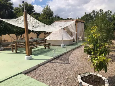 a tent and a picnic table and a tree at Camping Tent Downtown & Garden Hanging Bed in Porto Rafti