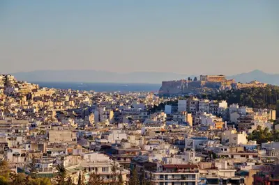 an aerial view of the city of athens at Alex Suite Θερμαινόμενο Τζακούζι & Θέα Ακρόπολη in Athens