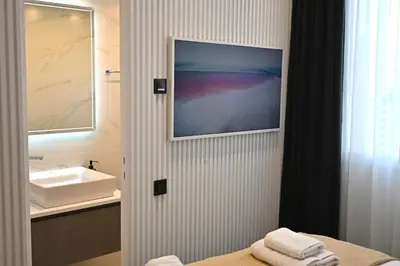 a bathroom with a sink and a picture on the wall at Monastiraki 513 SuperHost Hub in Athens