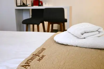 a bed with white towels on top of it at Monastiraki 513 SuperHost Hub in Athens