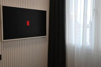 a flat screen tv on a wall next to a window at Monastiraki 513 SuperHost Hub in Athens