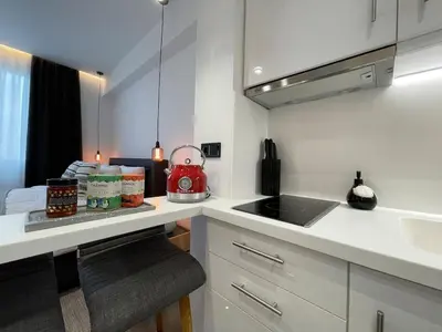 a kitchen with a counter with a sink and a stove at Monastiraki 513 SuperHost Hub in Athens
