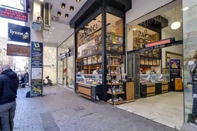 a man standing in front of a store at Monastiraki 513 SuperHost Hub in Athens