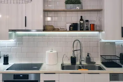 a kitchen with a sink and a counter top at Hidden gem on the Piraeus Coast in Piraeus