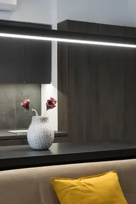 a kitchen with a vase with flowers on a counter at Academy Elegant Apartment #101 in Athens