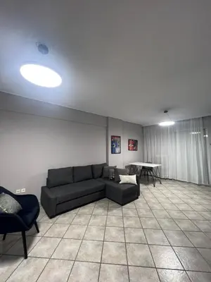 a living room with a couch and a table at anastasis house in Athens