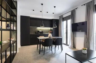 a kitchen and dining room with a table and chairs at Academy Elegant Apartment #102 in Athens