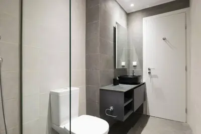 a bathroom with a toilet and a sink at Academy Elegant Apartment #102 in Athens