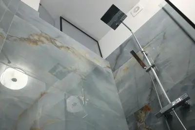 a bathroom with a glass counter top with dirt on it at Agnes apartment Filopappou in Athens