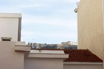 a view of the roofs of two buildings at Best spot apartment in Athens in Athens