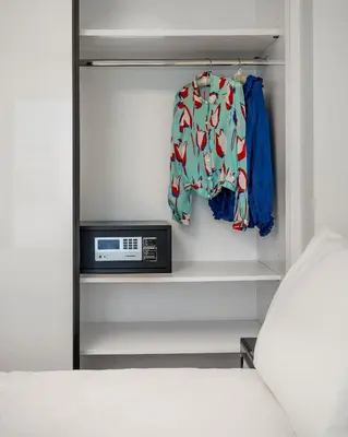 a closet with a bed and a radio in it at Athens Riviera Penthouse in Athens