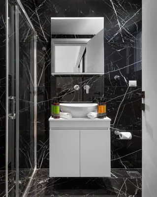 a bathroom with a white sink and a mirror at Athens Riviera Penthouse in Athens